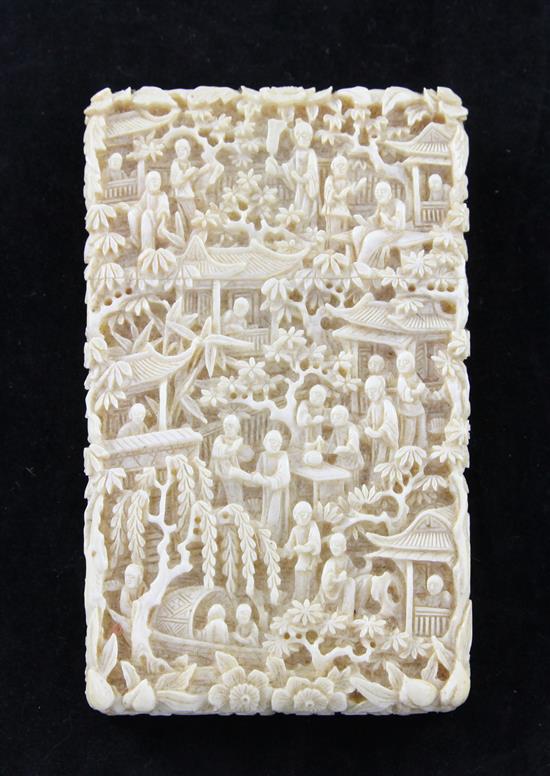 A Chinese export carved ivory card case, 19th century, 11cm, with original brocade covered card box (a.f.)